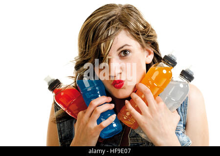Young woman holding several energy drink bottles in her hands Stock Photo