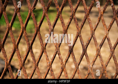 Old rusty expanded metal on outdoors background Stock Photo