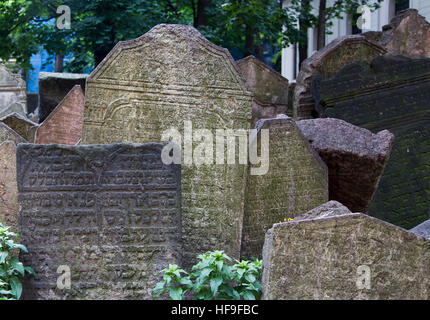 PRAGUE, CZECH REPUBLIC - June 19, 2015: Abandoned tombstones at the Old Jewish Cemetery in Prague, Czech Republic. Stock Photo
