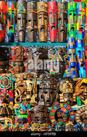 Selection of Mayan face masks and carvings, depicting Mayan culture, on sale at Chichen Itza temple, Yucatan, Mexico Stock Photo