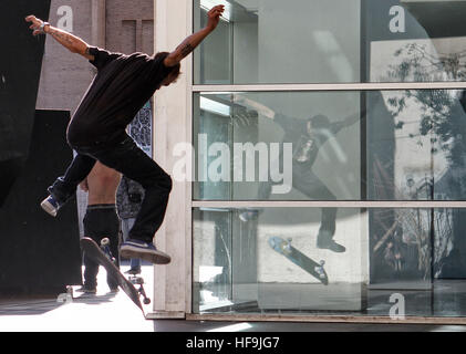 Boy skateboarding in Barcelona in front of the Museum of Contemporary Art of the city. Stock Photo