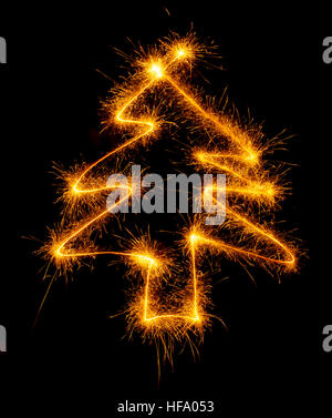 Christmas tree made by sparkler on a black background Stock Photo