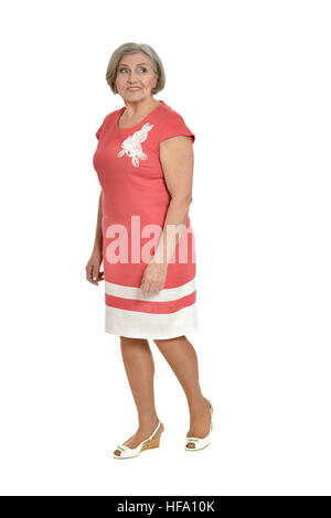 senior woman in coral dress Stock Photo