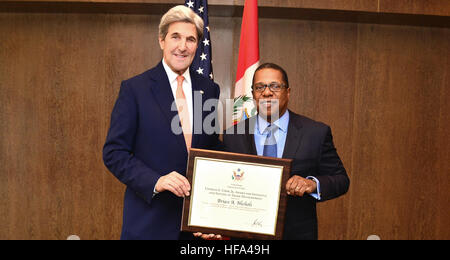 U.S. Secretary of State John Kerry poses for a photo with U.S. Ambassador to Peru Brian Nichols in Lima, Peru, on November 18, 2016. The Secretary presented the Ambassador the Charles E. Cobb, Jr. Award for his initiative in promoting commerce and prosperity in Peru. Stock Photo
