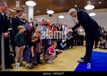 U.S. Secretary of State John Kerry greets the children of staffers at U.S. Embassy Berlin in Berlin, Germany, on December 5, 2016, before a bilateral meeting with German Foreign Minister Frank-Walter Steinmeier, and his receiving the Order of Merit from the German government. Stock Photo