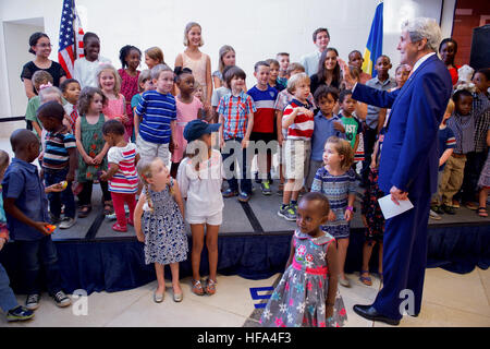 U.S. Secretary of State John Kerry greets children as he arrives at U.S. Embassy Kigali so the Secretary can greet its staff and their family members during a visit to the Rwandan capital on October 14, 2016, to attend a conference focused on amending the Montreal ozone layer protection protocol. Stock Photo