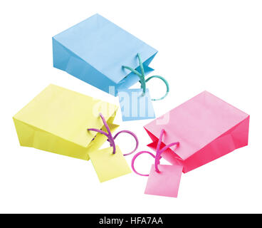 Three Paper Bags With Tags Lying on White Backgroundl Stock Photo