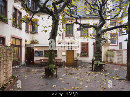 Apfelwein, hard cider  , a regional specialty in Hesse Germany served in cozy inns all over Frankfurt am Main, backyard entrance Stock Photo