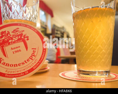 Apfelwein, hard cider or apple wine, a regional specialty in Hesse Germany served in Geripptes glass cozy inns all over Frankfurt am Main Stock Photo