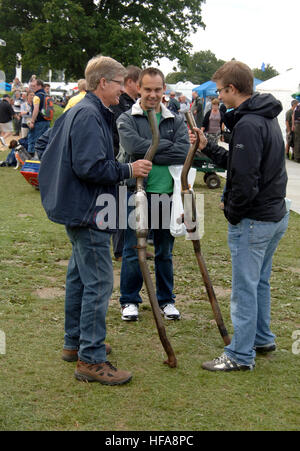 Classic car owners look through stalls of rare parts and automobilia at Beaulieu Autojumble Stock Photo