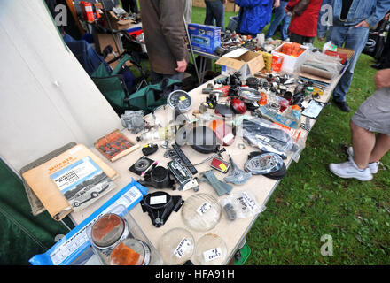 Classic car owners look through stalls of rare parts and automobilia at Beaulieu Autojumble Stock Photo