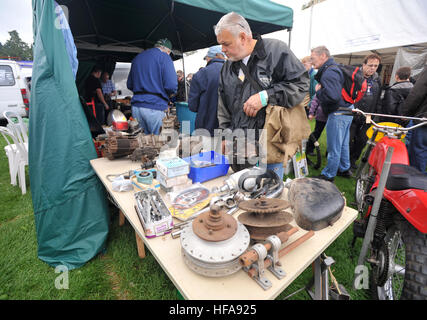 Classic car owners look through stalls of rare parts and automobilia at Beaulieu Autojumble Stock Photo