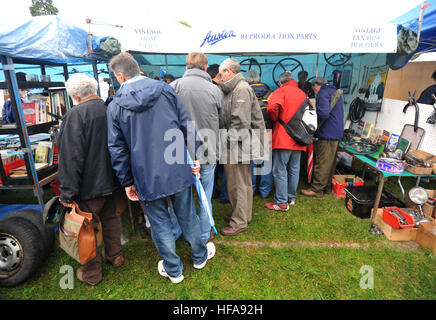 Classic car owners look through stalls of rare parts and automobilia at Beaulieu Autojumble Stock Photo