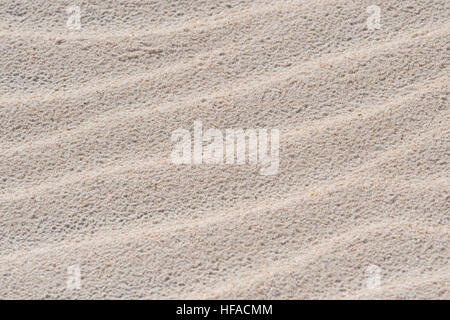 Waves in Sand Background left by the receding tide Stock Photo