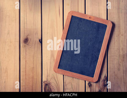 empty blackboard on the wooden table Stock Photo