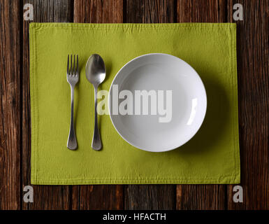 The empty plate with cutlery on the table Stock Photo