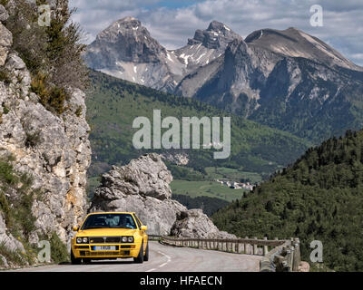 1995 Lancia Delta HF Integrale driving on roads in the French alps Stock Photo