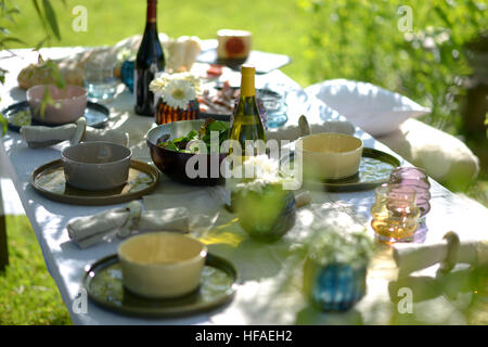 Alfresco dining, table set for an evening meal outside Stock Photo