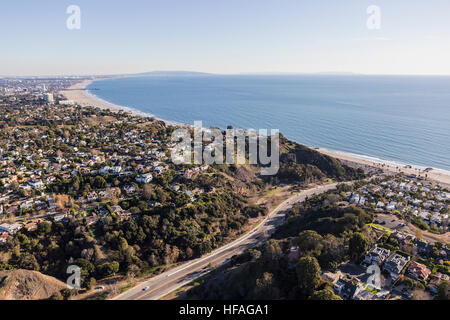 Aerial of Temescal Canyon Road and Pacific Palisades neighborhoods near Santa Monica Bay in Southern California. Stock Photo