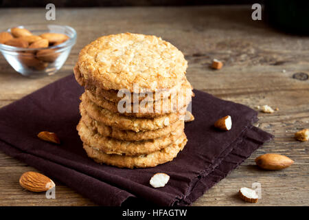 Homemade almond cookies on wooden table with copy space - healthy homemade vegan vegetarian pastry with almonds nuts Stock Photo