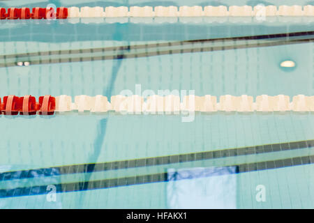 Lane Lines and markers are seen in an indoor pool. Stock Photo