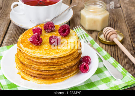 Lush and tender Pancake with berries in sugar Stock Photo