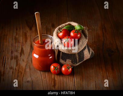tomato sauce in glass jar Stock Photo