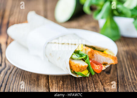 Chicken Wrap (detailed close-up shot; selective focus) on wooden background Stock Photo