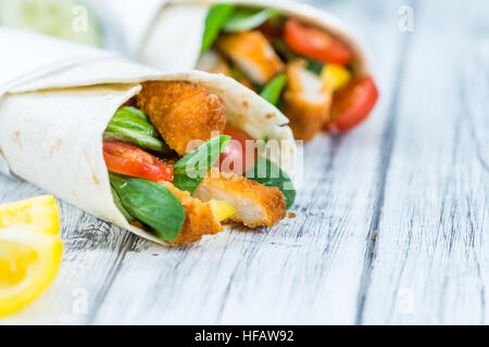 Chicken Wrap (detailed close-up shot; selective focus) on wooden background Stock Photo