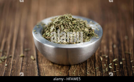 Old wooden table with dried Stevia leaves (close-up shot; selective focus) Stock Photo