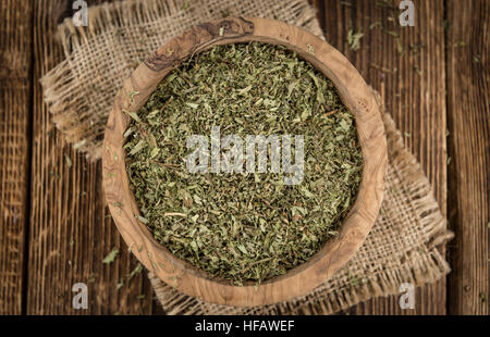 Old wooden table with dried Stevia leaves (close-up shot; selective focus) Stock Photo