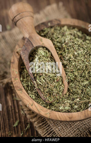 Old wooden table with dried Stevia leaves (close-up shot; selective focus) Stock Photo