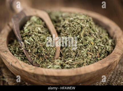 Old wooden table with dried Stevia leaves (close-up shot; selective focus) Stock Photo