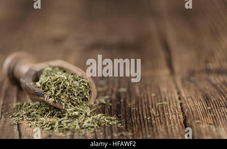 Old wooden table with dried Stevia leaves (close-up shot; selective focus) Stock Photo