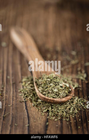 Old wooden table with dried Stevia leaves (close-up shot; selective focus) Stock Photo