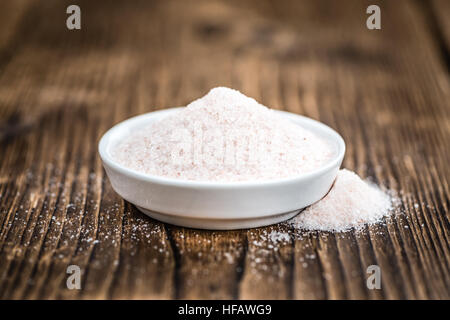 Pink Himalayan Salt on rustic wooden background (close-up shot) Stock Photo