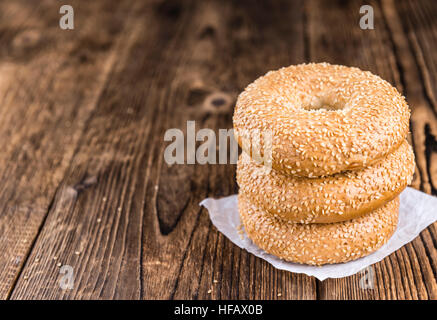 Sesame Bagels on an old wooden table (selective focus; close-up shot) Stock Photo