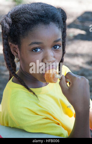 Girl eating a popsicle Stock Photo