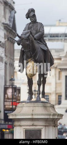 The equestrian statue of Prince George, Duke of Cambridge, gains a net of hay over the Christmas period, Whitehall, London. Stock Photo