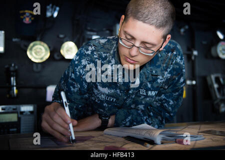 PACIFIC OCEAN (March 23, 2015) Quartermaster Seaman Apprentice Brandon Sassonlevy, from Plainview, N.Y., charts a course the bridge of the San Antonio-class amphibious transport dock ship USS Anchorage (LPD 23) during a simulated strait transit. Anchorage is underway participating in a Composite Training Unit Exercise (COMPTUEX) with the Essex Amphibious Ready Group (ARG), which is comprised of Amphibious Squadron (PHIBRON) THREE and 15th Marine Expeditionary Unit (MEU). (U.S. Navy photo by Mass Communication Specialist 3rd Class Liam Kennedy/Released) COMTUEX 150323-N-BD107-042 Stock Photo