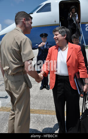 Capt. Christopher W. Plummer, commanding officer of Naval Air Station Pensacola, greets Department of Homeland Security Secretary Janet Napolitano as she arrives at the air station to meet with state and local officials and provide an update on the Deepwater Horizon oil spill in the Gulf of Mexico. (U.S. Navy photo by Anne Thrower) Deepwater Horizon 278251 Stock Photo