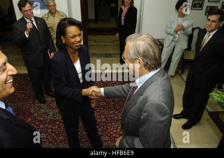 060426-N-0696M-435 Secretary of Defense Donald H. Rumsfeld greets Secretary of State Condoleezza Rice in Baghdad, Iraq, on April 26, 2006.  Rumsfeld and Rice made an unannounced visit to Iraq to meet jointly with Iraq's newly designated Prime Minister Jawad al-Maliki to show support for the continuing process of building a new Iraqi government.  Rumsfeld earlier met with Commanding General, Multi-National Force Iraq Gen. George Casey Jr.  DoD photo by Petty Officer 1st Class Chad J. McNeeley, U.S. Navy.  (Released) Defense.gov News Photo 060426-N-0696M-435 Stock Photo