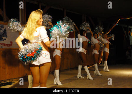 Miami Dolphins' cheerleaders entertained Soldiers, Sailors, Marines and Airmen on a tour of the area. They performed a few dance routines and signed autographs for the troops. Dolphins cheerleaders Djibouti 7 Stock Photo