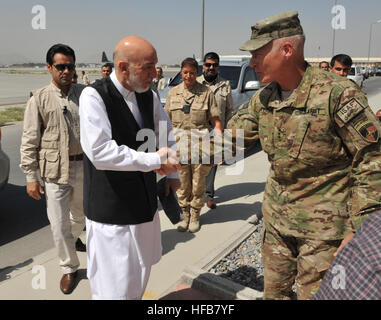 U.S. Army Lt. Gen. James L. Terry, right, the commander of the International Security Assistance Force Joint Command, greets Afghan President Hamid Karzai on the flight line at Kabul International Airport in Kabul province, Afghanistan, Aug. 21, 2012. (U.S. Navy photo by Chief Mass Communication Specialist Roger Duncan/Released) 120821-N-YZ252-029 (7839948420)