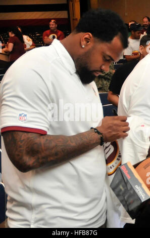 120608-N-JX924-140  NORFOLK (June 8, 2012) Players from the Washington Redskins sign autographs for fans during the Washington Redskins'80th Anniversary Thank You tour pep rally held at Naval Station Norfolk. The Thank You tour allows Redskins'players, coaches, and cheerleaders a chance to thank their fans in during a fan-friendly pep rally. (U.S. Navy photo by Mass Communication Specialist 3rd Class Tamekia L. Perdue/Released) Doug worthington 2012 Stock Photo