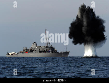 101119-N-6266K-023 STRAITS OF HORMUZ (Nov. 19, 2010) A demolition charge detonates 1,500 meters from Avenger-class mine countermeasures ship USS Scout (MCM 8). The charge was built and detonated by Sailors assigned to Explosive Ordnance Disposal Mobile Unit (EODMU) 1 and Mobile Diving and Salvage Unit (MDSU) 2, attached to Combined Task Group 56.1, during joint mine countermeasures training. Scout is attached to Combined Task Force 151 deployed in support of maritime security operations in the U.S. 5th Fleet area of responsibility. (U.S. Navy photo by Mass Communication Specialist 1st Class Jo Stock Photo