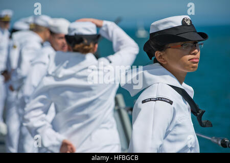 120814-N-BT887-358  LOS ANGELES (Aug. 14, 2012) Ship’s Serviceman 3rd Class Masheela Fejeran, assigned to the Arleigh Burke-class guided-missile destroyer USS Wayne E. Meyer (DDG 108), gets into position while manning the rails during Navy Days L.A. 2012. Navy Days L.A. is designed to educate the public through tours, distinguished visitor embarks and media coverage of the festivities. (U.S. Navy photo by Mass Communication Specialist 2nd Class Benjamin Crossley/Released)  - Official U.S. Navy Imagery - A Sailor gets into position. Stock Photo