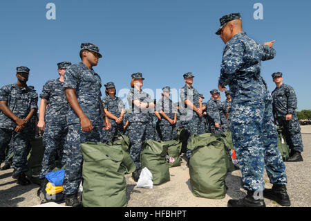 PENSACOLA, Fla. (Aug. 26, 2012) Hundreds of staff and students at the Center for Information Dominance Unit Corry Station muster early Sunday morning in preparation for Tropical Storm Isaac. The students were directed to pack a seabag for five days in the event of evacuation. The storm is expected to make landfall along the Gulf Coast late Tuesday evening. The last major storm to affect Northwest Florida was Hurricane Dennis, a category three hurricane, which made landfall near Pensacola July 10, 2005. (U.S. Navy Photo by Gary Nichols/Released) 120826-N-GS507-049 Join the conversation http://w Stock Photo