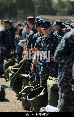 PENSACOLA, Fla. (Aug. 26, 2012) Hundreds of staff and students at the Center for Information Dominance Unit Corry Station muster early Sunday morning in preparation for Tropical Storm Isaac. The students were directed to pack a seabag for five days in the event of evacuation. The storm is expected to make landfall along the Gulf Coast late Tuesday evening. The last major storm to affect Northwest Florida was Hurricane Dennis, a category three hurricane, which made landfall near Pensacola July 10, 2005. (U.S. Navy Photo by Gary Nichols/Released) 120826-N-GS507-030 Join the conversation http://w Stock Photo