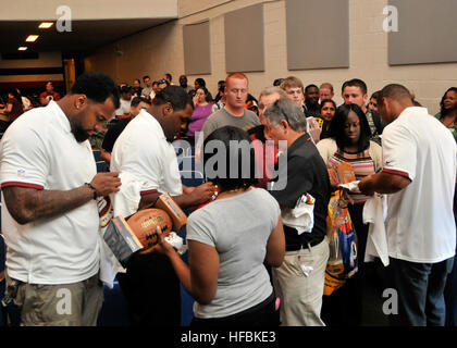 120608-N-JX924-140  NORFOLK (June 8, 2012) Players from the Washington Redskins sign autographs for fans during the Washington Redskins'80th Anniversary Thank You tour pep rally held at Naval Station Norfolk. The Thank You tour allows Redskins'players, coaches, and cheerleaders a chance to thank their fans in during a fan-friendly pep rally. (U.S. Navy photo by Mass Communication Specialist 3rd Class Tamekia L. Perdue/Released)  - Official U.S. Navy Imagery - Players from the Washington Redskins sign autographs for fans during the Washington Redskins'80th Anniversary Thank You tour pep rally h Stock Photo